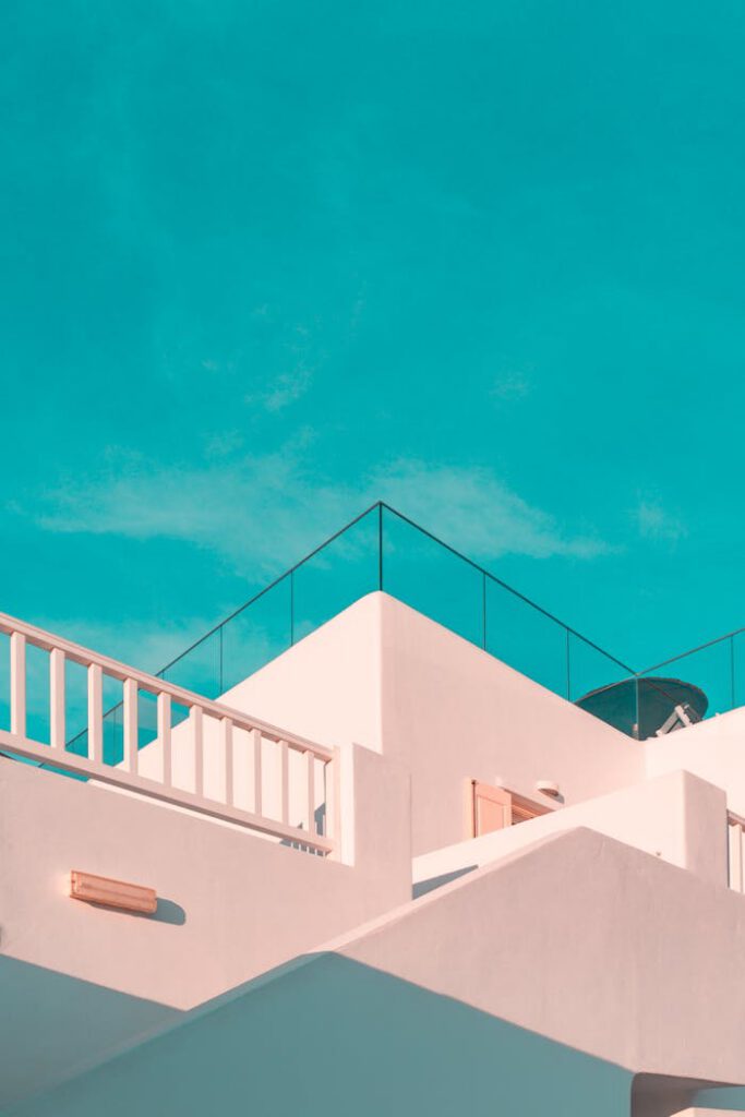 The Art of Drawing Readers In: Your attractive post title goes here Explore the clean lines of modern Cycladic architecture under a clear blue sky in Platis Gialos, Greece.